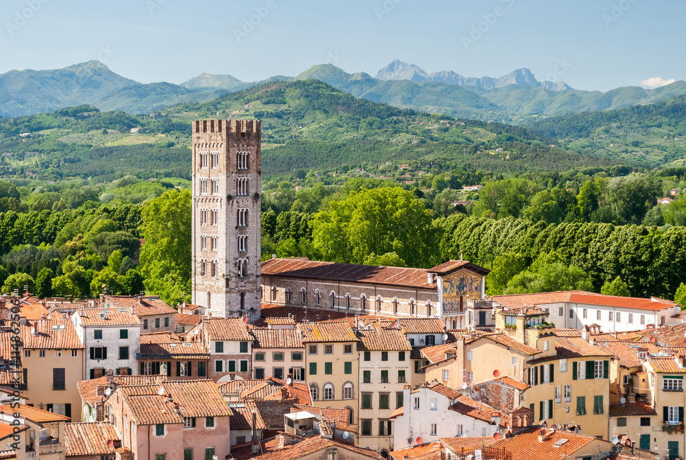 Historic Lucca: terracotta rooftops, cathedral and bell tower, green hills beyond